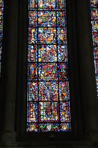 Modern window depicting the story of wine making in region.